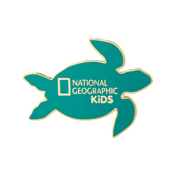 A green turtle-shaped enamel pin with the National Geographic Kids logo in the middle.