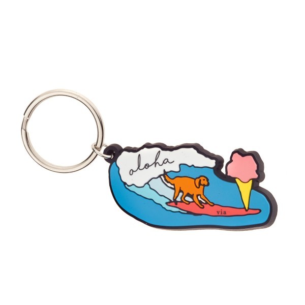 A soft PVC keyring made from rubber featuring a dog on a surf board.