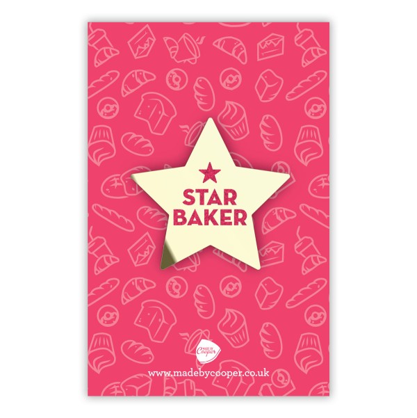 A gold star enamel pin with Star Baker written on in glittery red enamel.