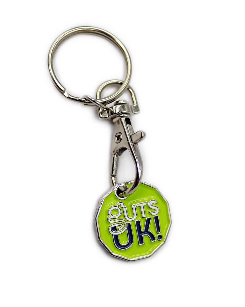 A wooden pin badge on a backing card for FreeAgent