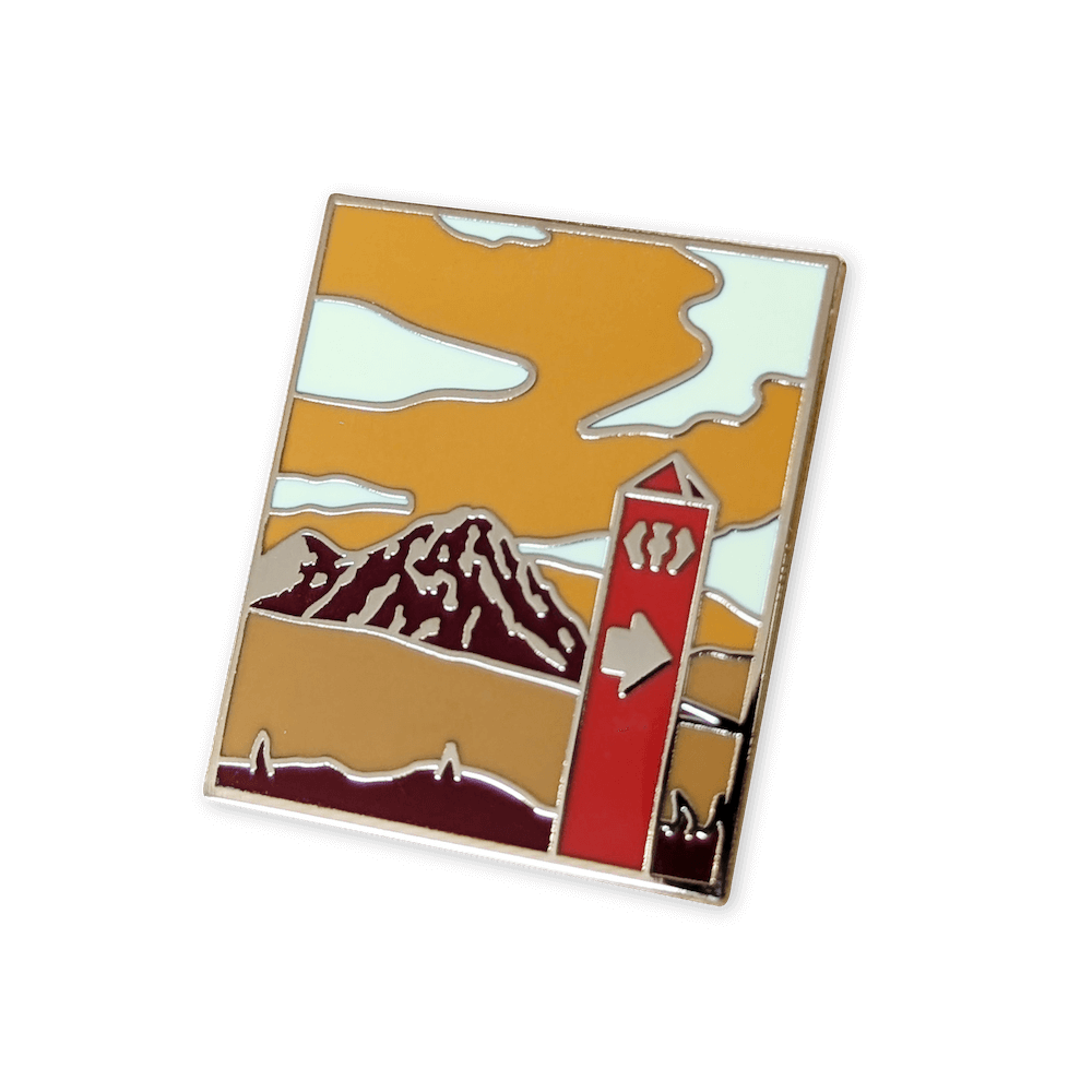 A mountain enamel pin badge