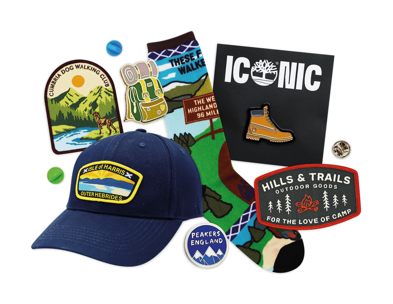 A collection of mixed merch featuring socks, pin badges, lanyards, patches and hats.