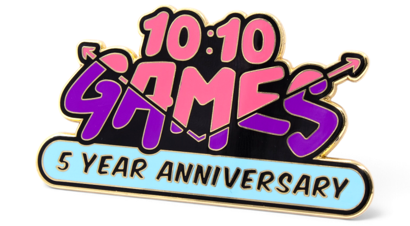 Colourful 10:10 Games 5-year anniversary fridge magnet featuring pink and purple lettering, gold edging and a blue banner.