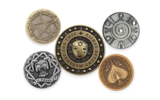 3D vs die-struck custom coins showing raised skull design and flat engraved coffee coin for comparison of depth and detail.