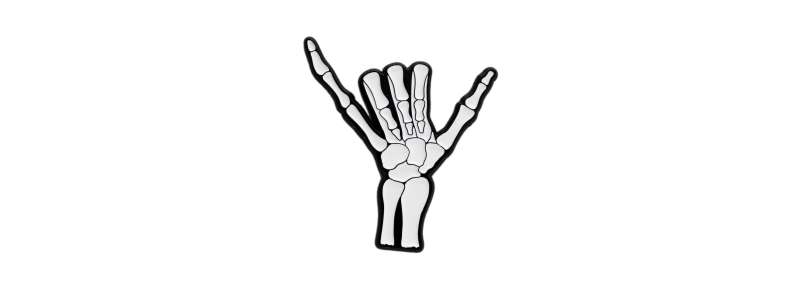 A pin badge of a creepy, boney hand doing the Shaka sign.