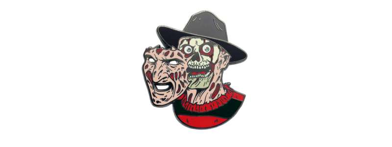 A horrifying pin badge of Freddie Kruegar with the front part of his face hanging off.