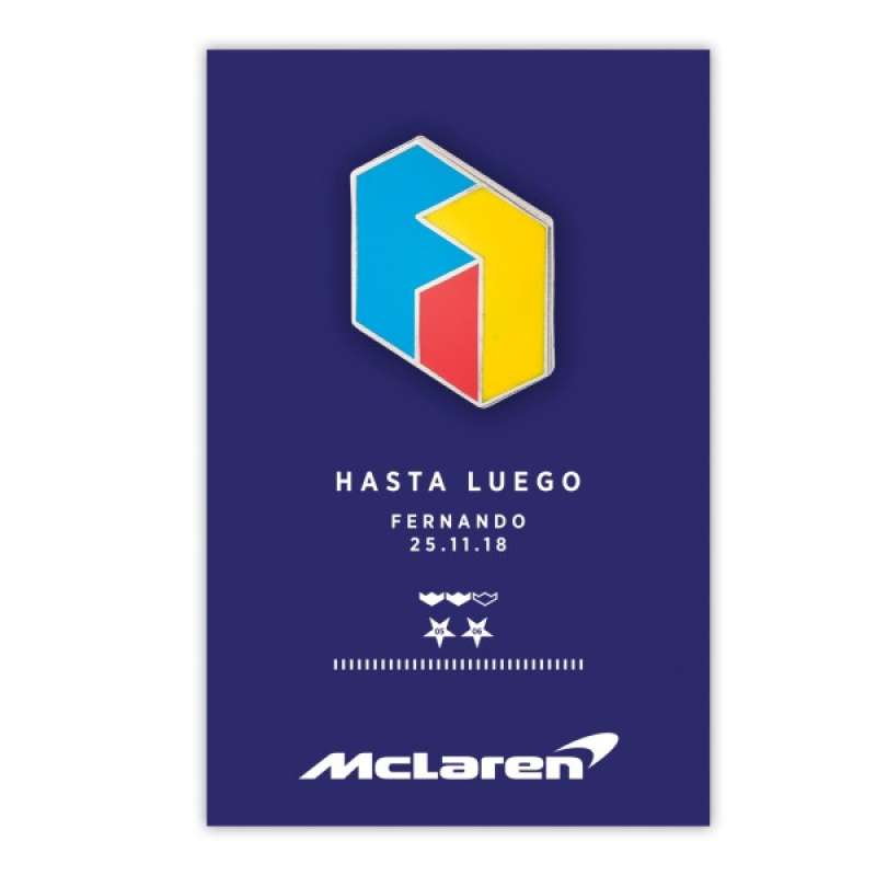 A red, yellow, and blue hard enamel pin badge representing Alonso's time in F1. The Navy blue backing card has a graphic to indicate Fernando's Formula 1 achievements and sports the McLaren logo.