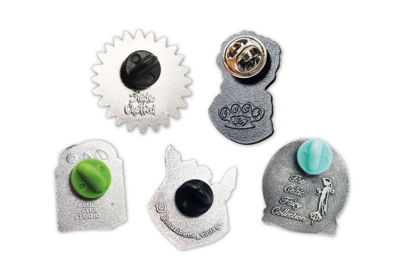 More backstamps on pin badges.