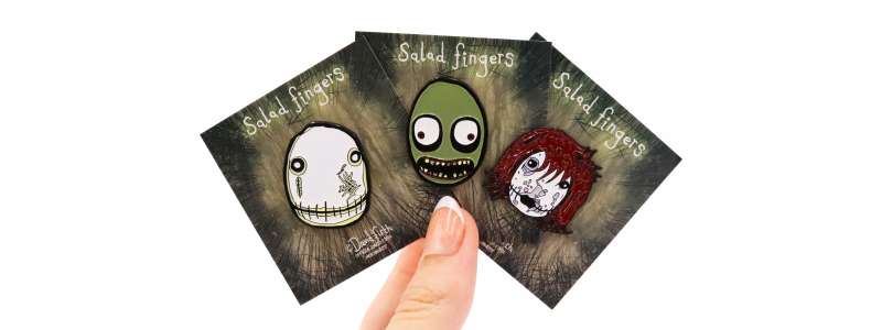 A collection of Salad Fingers creepy pin badges. Salad Fingers, Hubert Cumberdale, & Majory Stewart-Baxter.
