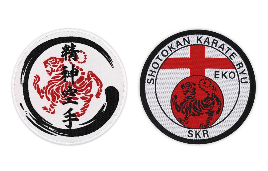 Two martial arts patches, both in red and black Japanese designs on a white background.