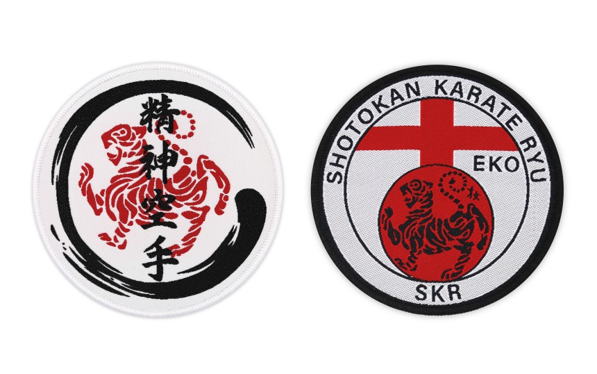 Two martial arts patches, both in red and black Japanese designs on a white background.