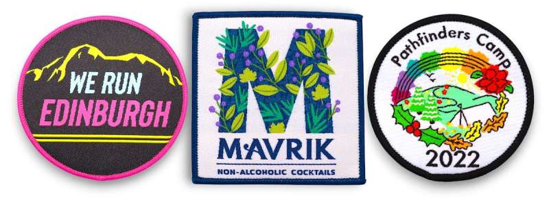 Bright custom woven patches with intricate artwork, small text, rainbow colours, and bold shapes for merch and branding.