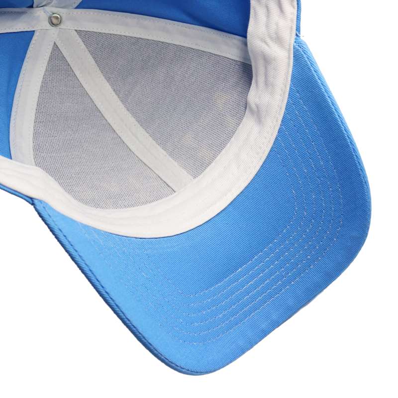 The inside of a pale blue curved peak baseball cap showcasing the cap sweatband and tape.