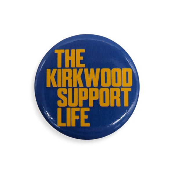 A blue charity button badge featuring the words