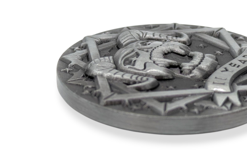 A close up of a custom challenge coin that shows the intricate details of a coin that has a satanic style design with a pentagram and horned skull.