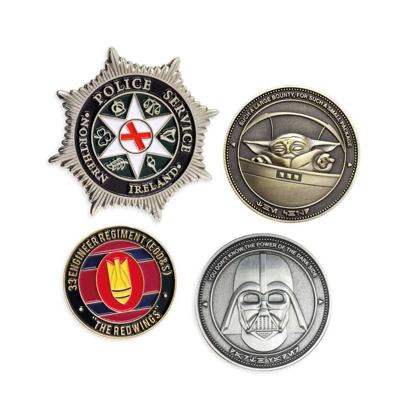 A collection of different challenge coins with color, finishes and shapes.