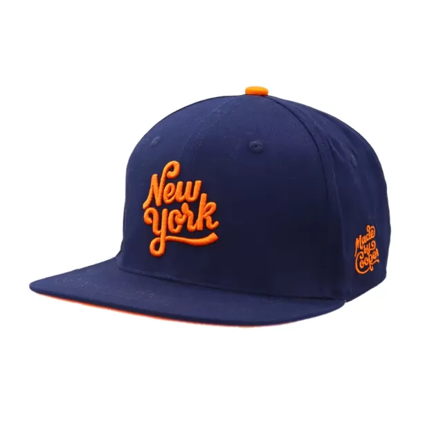 A navy blue custom hat with flat peak, orange embroidered logo and orange top button.