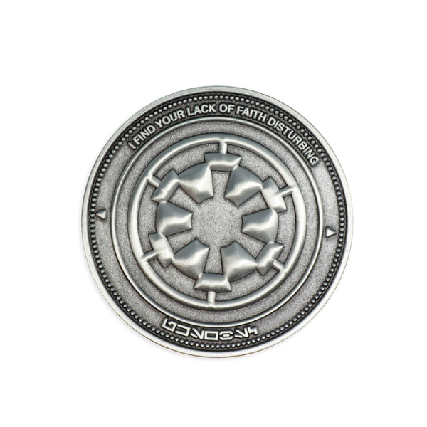 The reverse of the Darth Vader challenge coin that displays the seal of the evil empire with the words