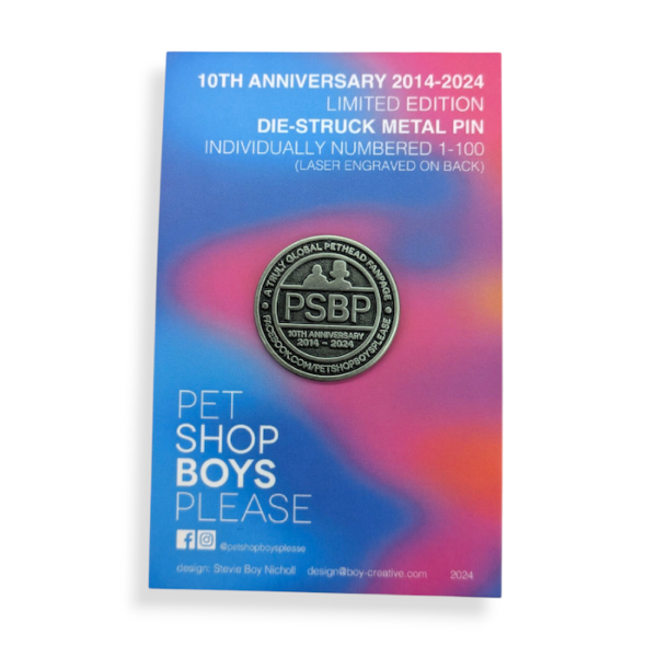 A nickel-plated die struck pin badge on a blue and pink backing card celebrating the Pet Shop Boys.