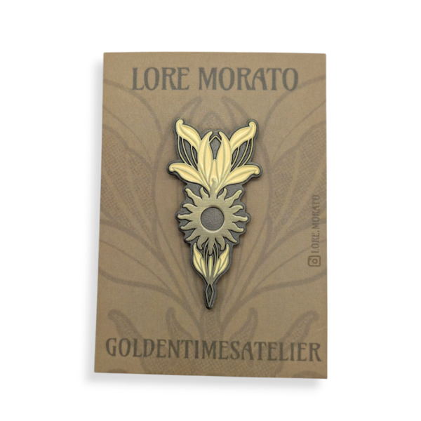 A flower-shaped custom die struck lapel pin on a brown stock backing card.