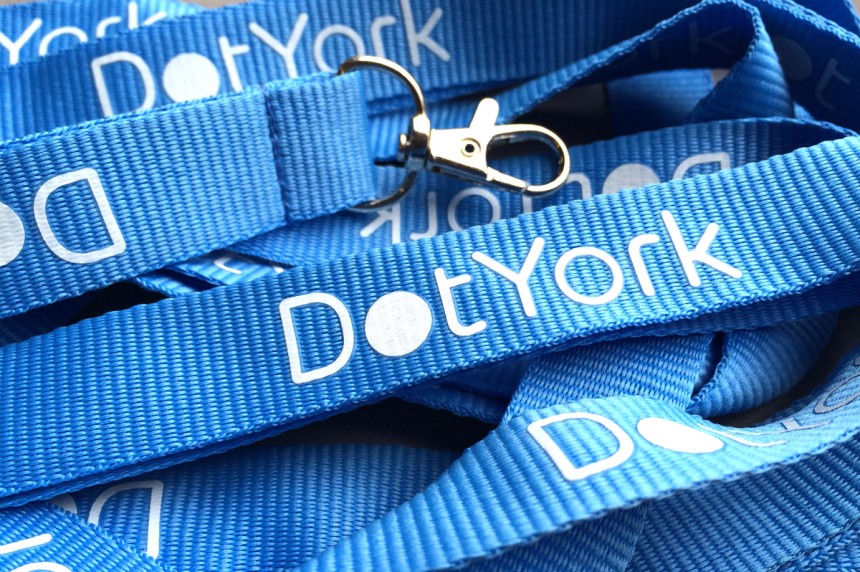 DotYork blue flat polyester lanyards with white print for web conference passes.