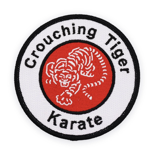 Circular embroidered patch featuring a tiger illustration and “Crouching Tiger Karate” text in red, black and white thread, created as a custom embroidered patch for martial arts clubs or uniform embroidered patches.