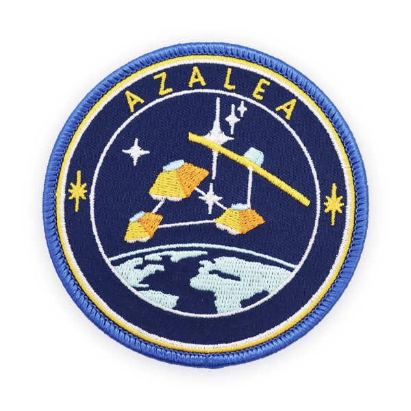 Round embroidered patch showing a space themed design with satellites, stars and Earth below, stitched in blue and yellow thread, designed as a custom embroidered patch for science, space or educational embroidered patches.