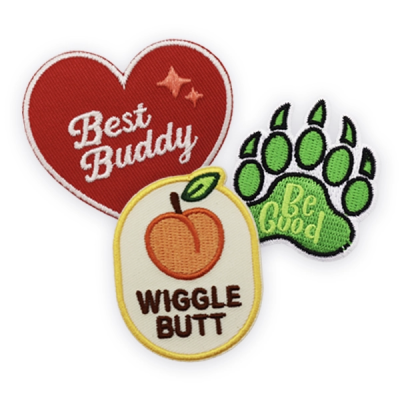 Custom patches featuring embroidered dog themed designs including “Best Buddy”, “Be Good” paw print and “Wiggle Butt” graphics, showcasing personalised custom patches ideal for pet brands, accessories, clothing and gifts.