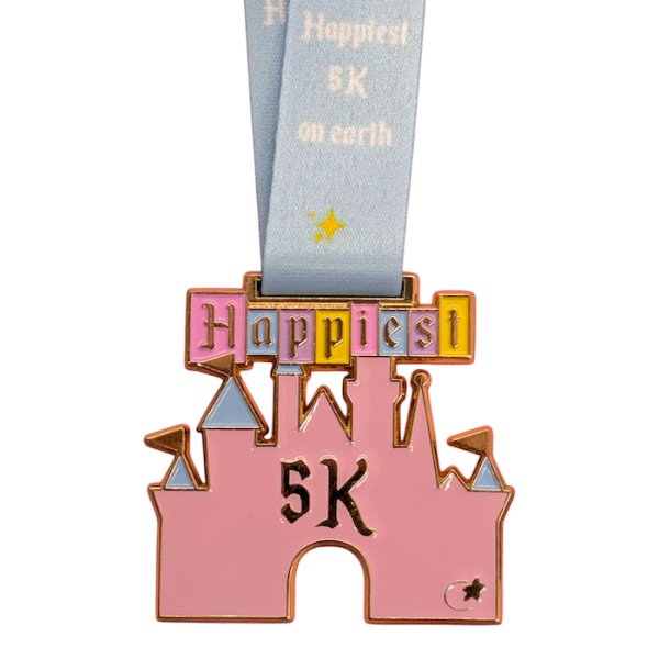 A pink castle-shaped medal that looks a bit like the Disney castle, but it's definitely not. The banner above the castle reads