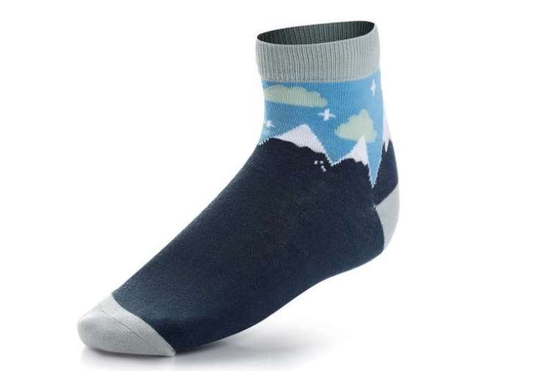 Fancy custom anti-slip socks with a mountain range pattern.