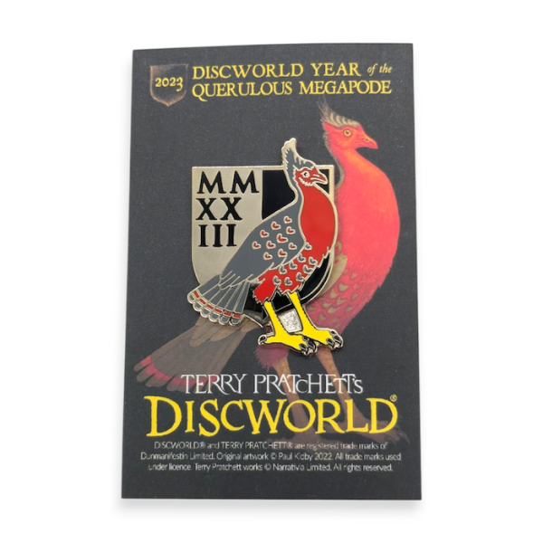 A custom pin badge featuring a black and red bird from Terry Pratchett's Discoworld.