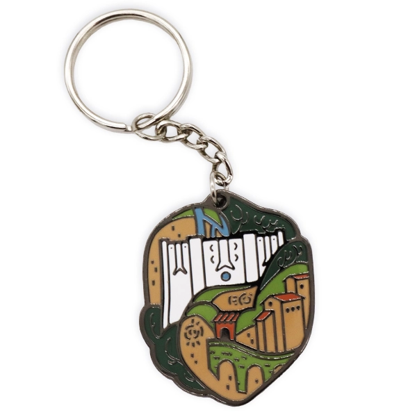Hard enamel keyring featuring a detailed castle and landscape illustration, showing the finish and durability of hard enamel keyrings.