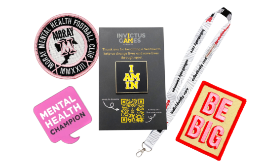 A collection of wellbeing custom merch from patches, to pin badges and lanyards.