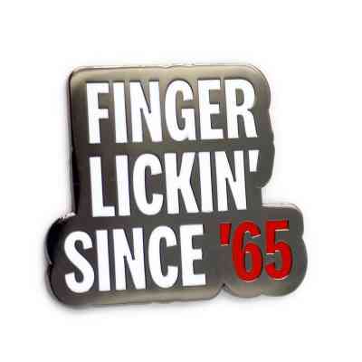 A hard enamel branding pin badge for KFC that says 