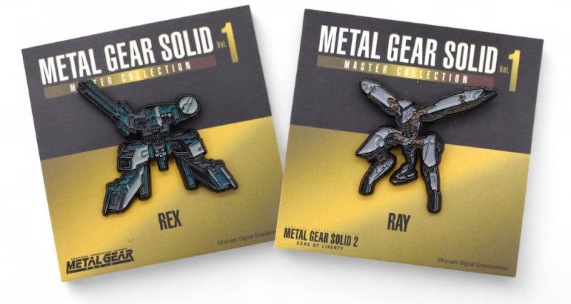 Metal Gear Solid Master Collection pins featuring REX and RAY mech designs on display cards.