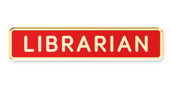 A gold-plated and red enamel librarian pin badge.