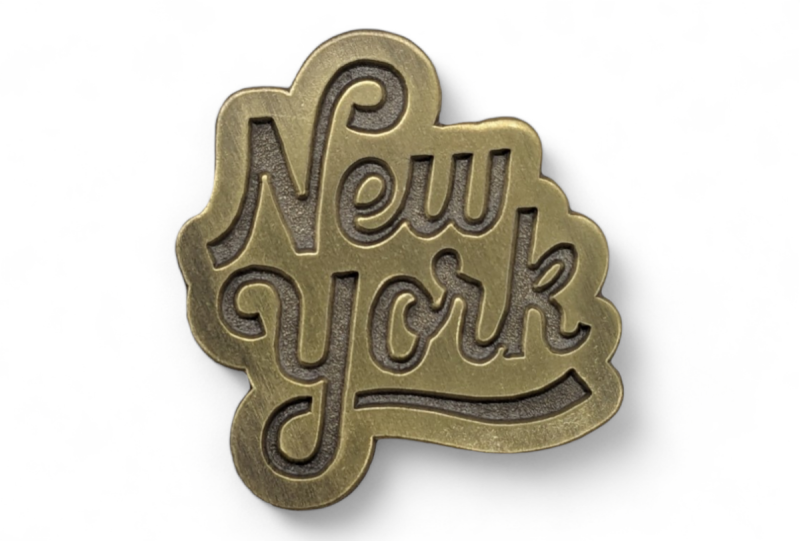 A New York logo retro enamel badge that showcases our ability to make vintage-looking lapel pins.