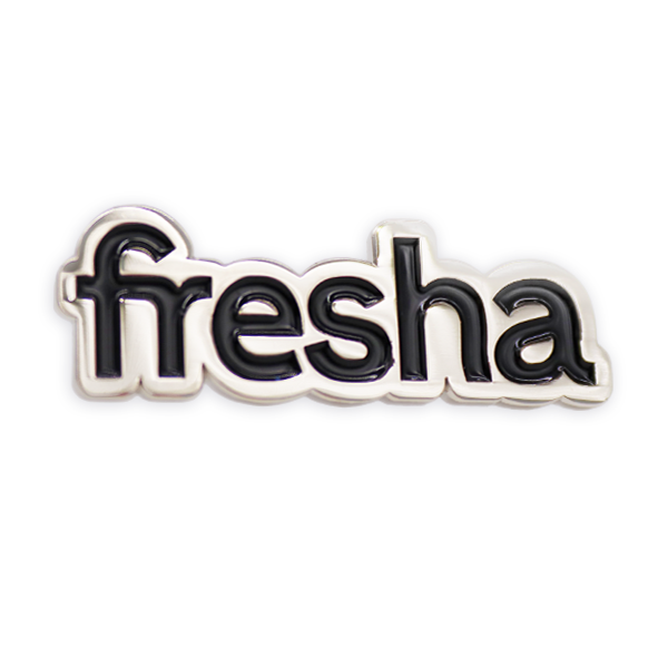 Soft enamel pin badge displaying the Fresha logo in black and white enamel with smooth metal edging, created as a minimalist branded soft enamel pin badge.