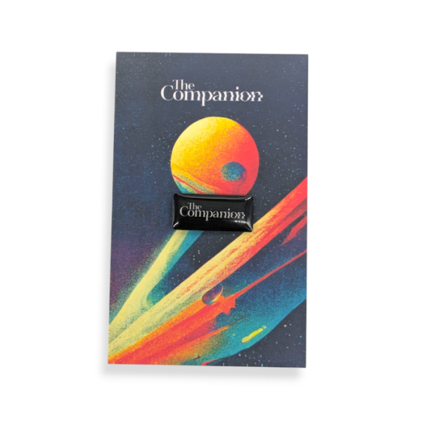 A branded custom printed pin attached to colourful backing card.