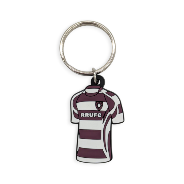 A custom soft PVC keyring in the shape of a rugby shirt with burgundy and white stripes with the clubs sponsor.