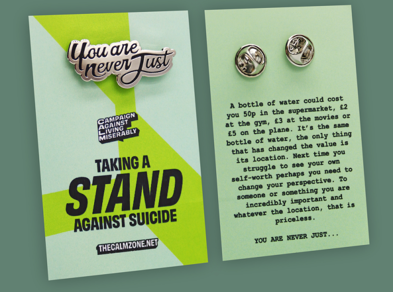 Taking a Stand pin badges that represent the fight against suicide.