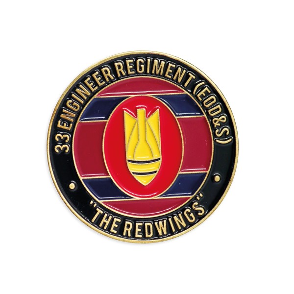 A coloured enamel black and red challenge coin celebrating a firefighter unit.