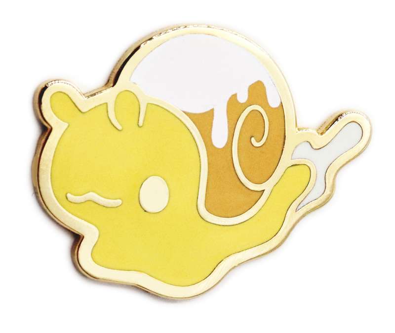 A enamel pin of a cute snail that has a cinnamon roll for a shell that has icing on the top.