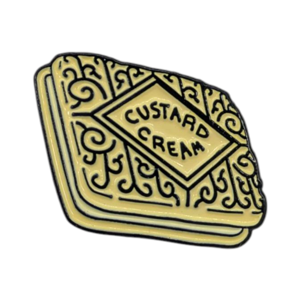 A soft enamel pin of a custard cream. It looks delicious.