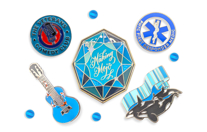 A collection of five pin badges that have blue hues to make a very appealing image.