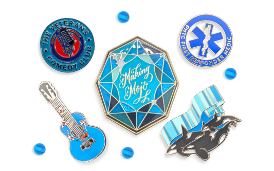 A collection of five pin badges that have blue hues to make a very appealing image.