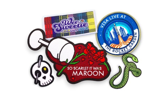 Collection of custom woven patches showing detailed logos, floral branding, event badges, and colourful fine thread designs.