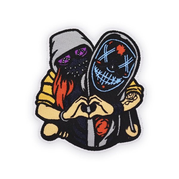 Detailed woven patch showing two masked figures forming a heart shape with their hands, stitched with bold colours and fine lines, designed as a custom woven patch for streetwear or statement pieces.