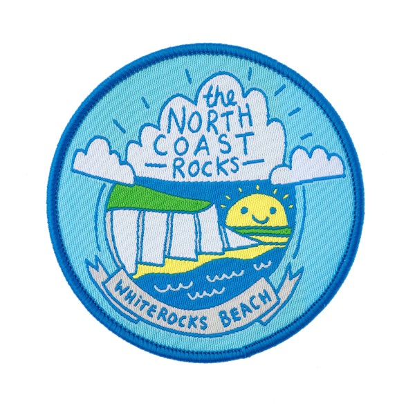 A custom woven patch with an ocean side view and a smily sun that reads