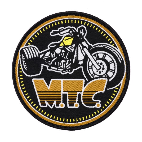 A round patch with a three-wheeled motorbike and MTC underneath.